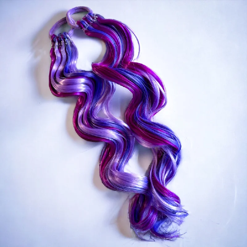 High - volume ponytails for a bold and glamorous appearancePurple Power 20” Magic Ponies