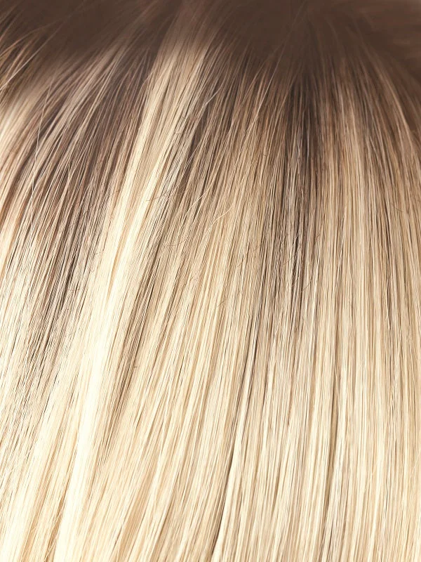 Champagne R | A platinum blonde with dark roots